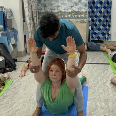 Students practicing yoga indoors during in-home session