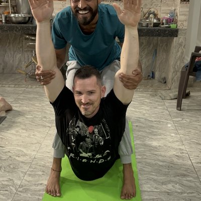 Student achieving advanced yoga pose