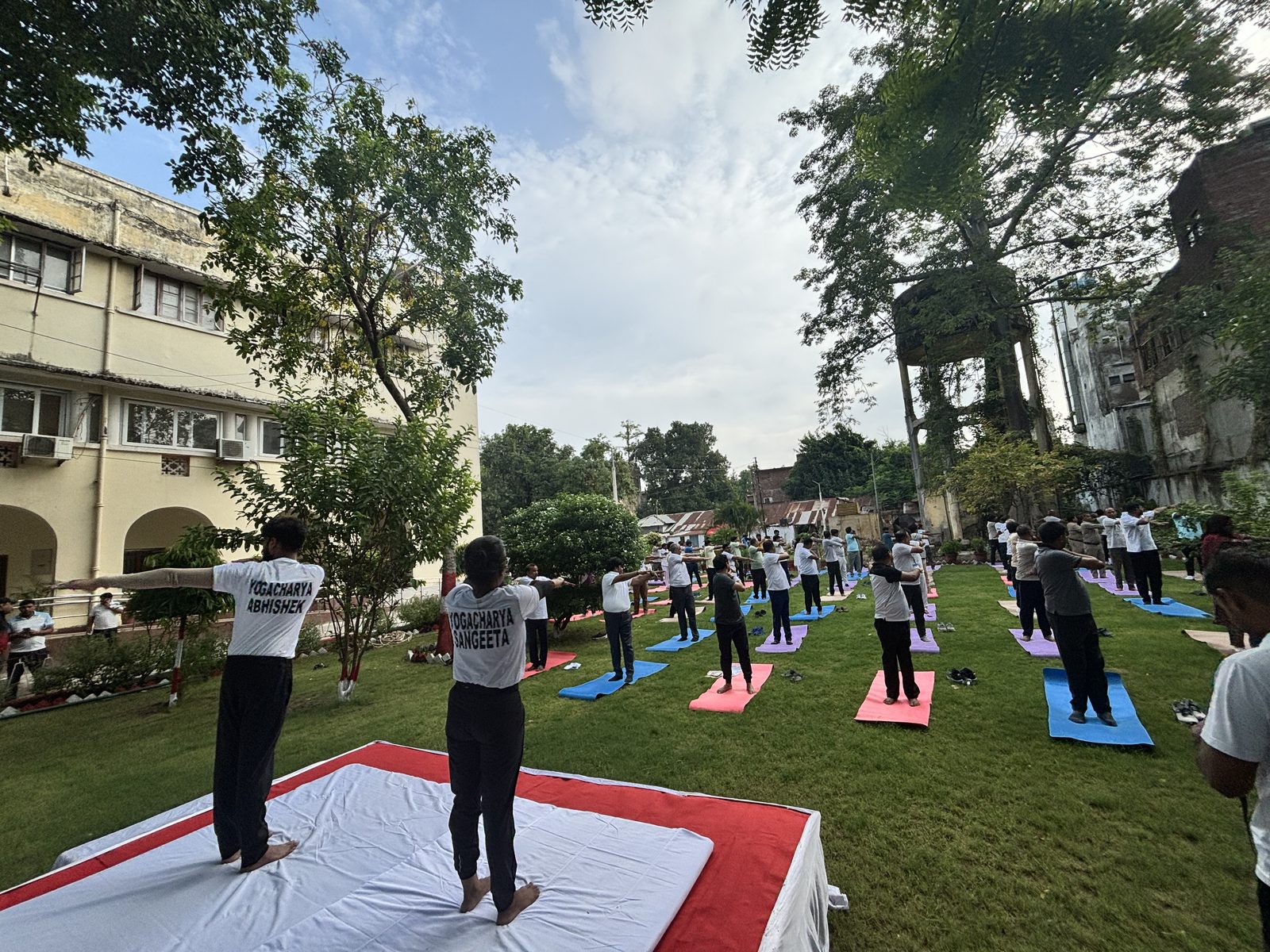 Yoga students with instructor at the Varanasi ghats